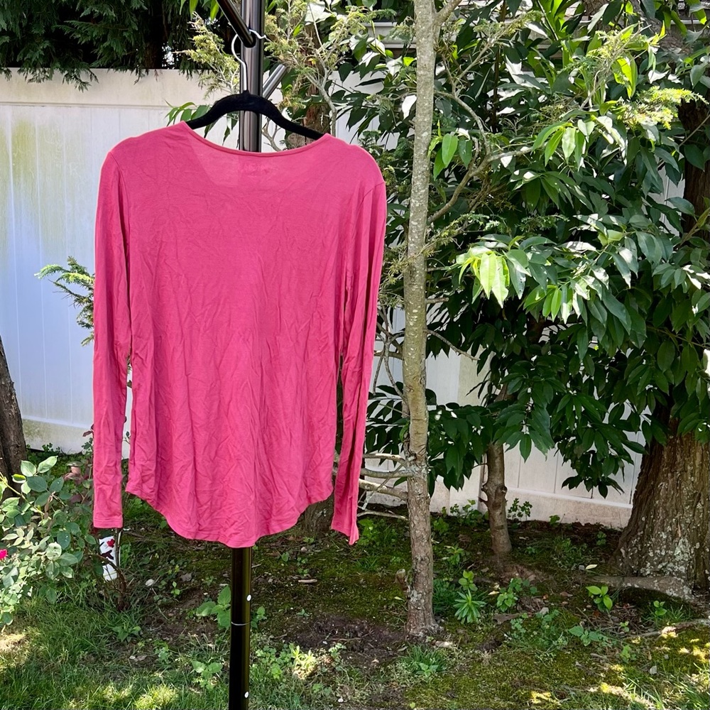 Rose colored long sleeved shirt.